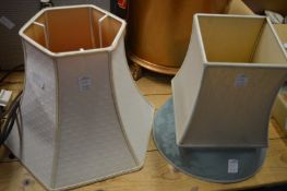 An old HMV heater and three lamp shades.