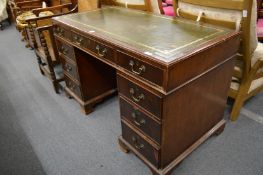 A mahogany pedestal desk.