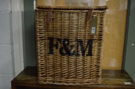 A Fortnum & Mason wicker hamper (lacking contents).