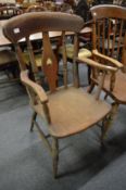 A 19th century ash and elm splat back Windsor armchair.