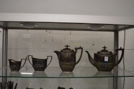 A plated four piece tea service.
