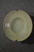 A Chinese celadon glazed lobed circular dish.