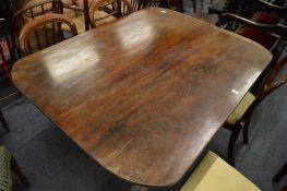 A 19th century mahogany tilt-top breakfast table, the top with later rounded corners on turned