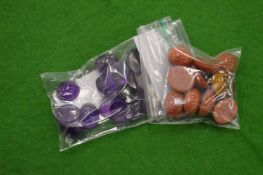 A collection of small bags containing colourful stones.