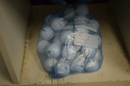 A bag of fifty Dunlop golf balls.