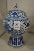 A Chinese blue and white pedestal bowl and cover.