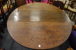An old oak drop leaf gateleg dining table with a drawer to each end.