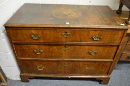 An early walnut three drawer chest (faults).