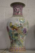 A Chinese famille rose vase decorated with exotic birds.