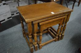An oak nest of tables.
