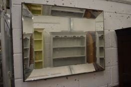 Modern rectangular wall mirror together with an Art Deco style mirror.