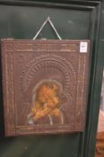 A Russian painted and embossed metal icon.