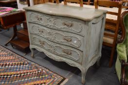 A large French three drawer commode with distressed green painted finish.
