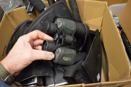 Camera equipment and accessories, together with other items.