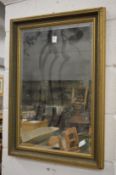 Decorative gilt framed rectangular wall mirror.