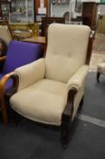 A Victorian walnut framed armchair.