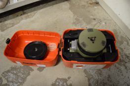 A surveyors level, boxed.