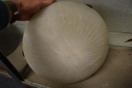 A carved alabaster ceiling shade.