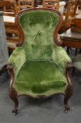 A good Victorian mahogany framed button upholstered armchair.