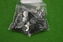 A collection of small bags containing colourful stones.