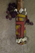 An African staff with shell decoration.