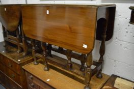 A mahogany drop leaf gateleg dining table.