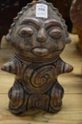 A Mexican painted pottery seated figure.