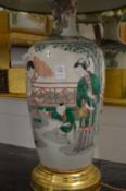 A large Chinese vase lamp.