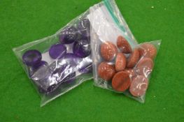 A collection of small bags containing colourful stones.