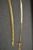 A highly ornate Eastern brass sword and scabbard, the gilded scabbard decorated with turquoise