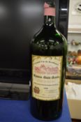 Two large red wine bottles (empty).