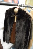A ladies lamb skin coat and three other items.