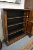 A mahogany free standing open bookcase.