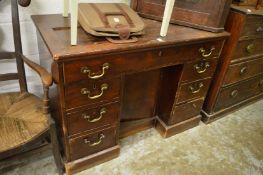Mahogany desk and an oak hanging corner cupboard.