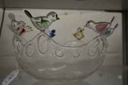 An unusual delicate glass bowl, the rim mounted with colourful glass birds.