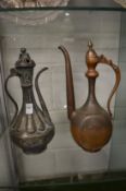 Two Eastern copper ewers.