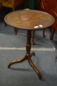 A mahogany tripod table.