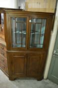 Mahogany standing corner cabinet.