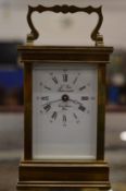 A brass carriage clock.