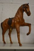 An unusual leather model of a prancing horse.