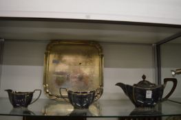 Plated three piece tea service and a plated tray with engraved inscription.