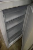 A Hotpoint upright fridge freezer.