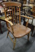 A 19th century beech and elm stick back Windsor armchair.