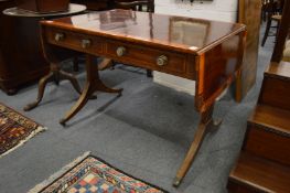 A Regency rosewood and satinwood banded sofa table (faults).