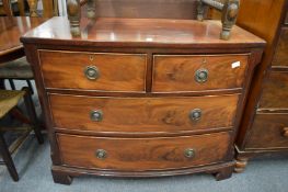 A mahogany bow front chest of drawers.