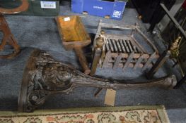 Two spark guards, a fire grate, cast iron table legs and another item.
