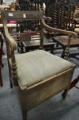 A 19th century mahogany commode chair.