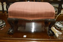 A small mahogany and upholstered stool on carved cabriole legs with claw and ball feet, labelled C