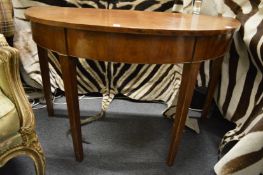 A mahogany demi lune side table.