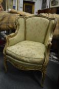 A French style armchair with carved and painted frame.